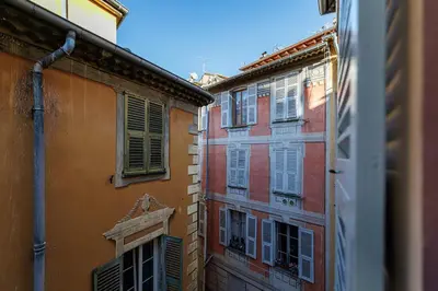 a view of two buildings with shutters on them at 1 GALLO LOT 3 - Joli appartement au coeur du Vieux-Nice - AC in Nice