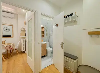 a small bathroom with a toilet and a sink at Cherie in Nice in Nice