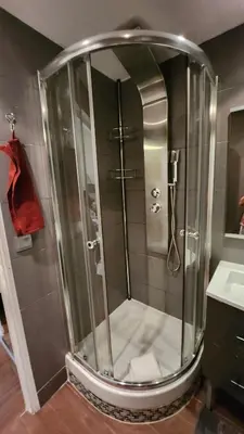 a shower with a glass door in a bathroom at Nice 2-room apartment off the beach in Nice