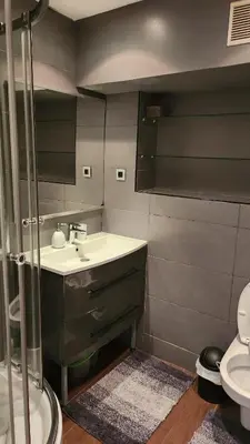 a bathroom with a sink and a toilet at Nice 2-room apartment off the beach in Nice