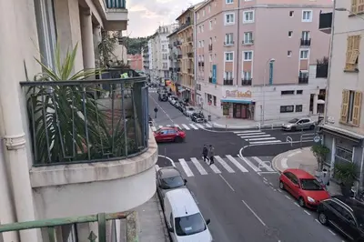 a view of a city street with cars on the road at Charming bright apartment in Nice in Nice