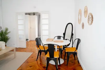a dining room with a table and chairs at Fantastic Centra Peaceful Location in Nice