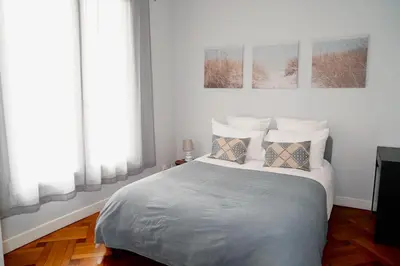a bedroom with a bed with two pillows on it at Fantastic Centra Peaceful Location in Nice