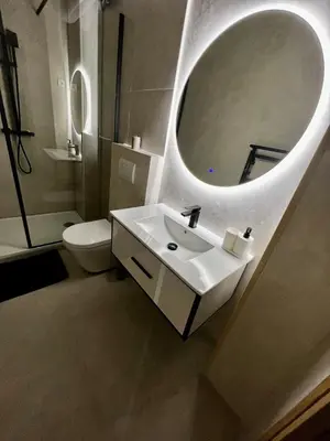 a bathroom with a white sink and a mirror at Luxueux Logement à 2 pas de la mer, Vieille ville in Nice