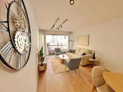 a living room with a couch and a table at Ref 127 - 3 Pièces 2 chambres Nice Port in Nice