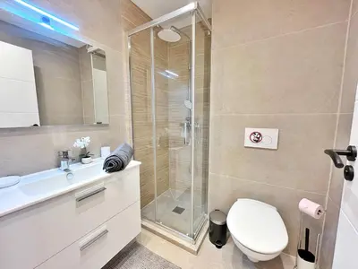 a bathroom with a shower and a toilet and a sink at Ref 127 - 3 Pièces 2 chambres Nice Port in Nice