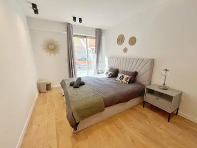 a bedroom with a large bed and a window at Ref 127 - 3 Pièces 2 chambres Nice Port in Nice