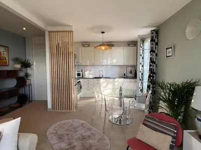 a kitchen with a table and chairs in a room at Golden hours luxury and panoramic view in Nice