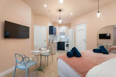 a bedroom with a bed and a table and chairs at Cocon stylé Centre et mer à pied CLIM WIFI in Nice