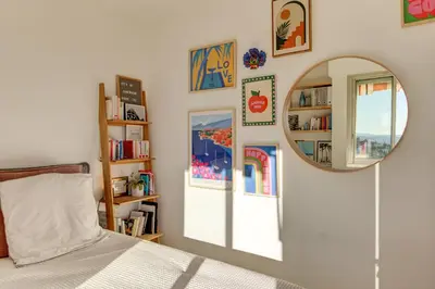 a bedroom with a bed and a mirror at - Casa ATI - in Villefranche-sur-Mer