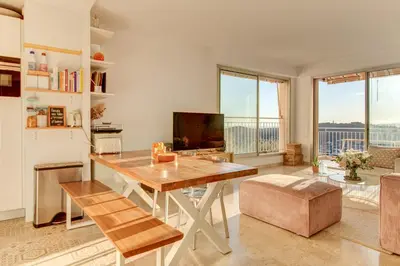 a living room with a table and a television at - Casa ATI - in Villefranche-sur-Mer