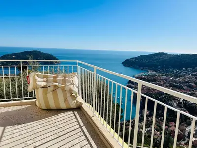 a bench sitting on a balcony overlooking the ocean at - Casa ATI - in Villefranche-sur-Mer