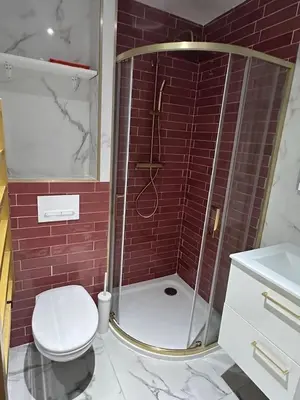 a bathroom with a shower with a toilet and a sink at MOON 23 - Appartement Nice 2P in Nice