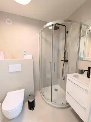 a bathroom with a shower and a toilet and a sink at Résidence So Amata , à deux pas du Port de Nice in Nice