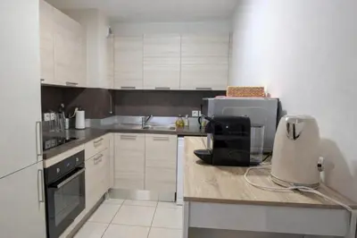 a kitchen with a sink and a counter with a appliance at Résidence So Amata , à deux pas du Port de Nice in Nice
