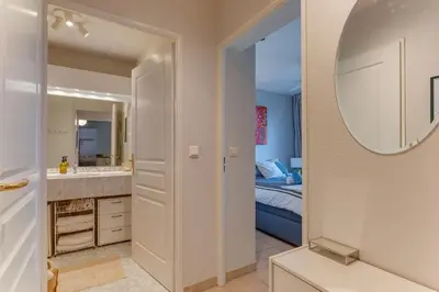 a bathroom with a sink and a mirror at IMPERIA AP4490 by RIVIERA HOLIDAY HOMES in Nice