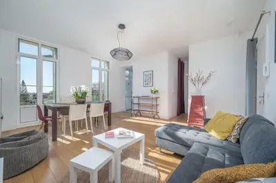 a living room with a couch and a table at Quartier Libération - La Vie à la Niçoise in Nice