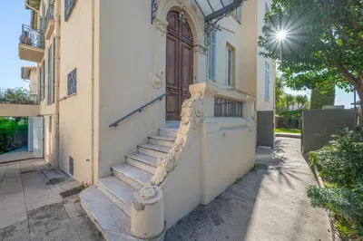 a building with a staircase leading to a door at Quartier Libération - La Vie à la Niçoise in Nice