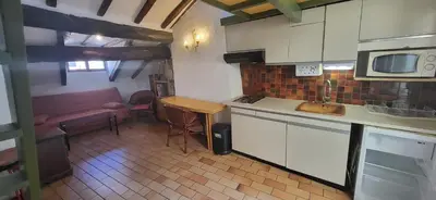 a kitchen with a table and a counter top at Nice Plage in Nice