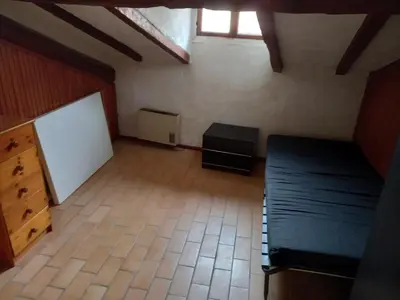 a bedroom with a bed and a whiteboard in a room at Nice Plage in Nice