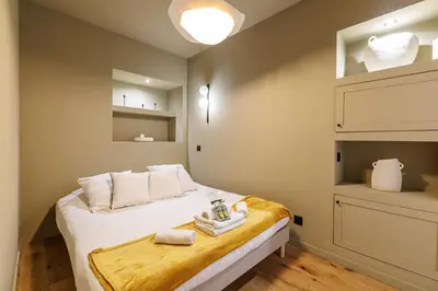 a bedroom with a bed with white towels on it at Wonderful Stay close to Garibaldi - Aircon in Nice
