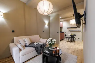 a living room with a couch and a table at Wonderful Stay close to Garibaldi - Aircon in Nice