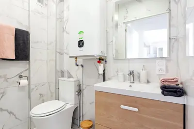 a bathroom with a shower with a glass door at Seaside Nice Comfort in Nice