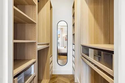 a dressing room with wooden shelves and a mirror at Nice Renting - AMOUR - Haussmann Luxury Sea Balcony Free Parking in Nice