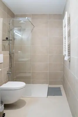 a bathroom with a toilet and a glass shower at T3 résidence neuve Centre-Ville 6 Couchages in Nice