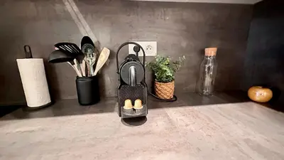 a egg holder with three eggs in it on a counter at Studio design et lumineux près du Port de Nice in Nice