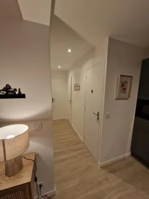 a bathroom with a sink and a hallway at Alex&Chris in Nice