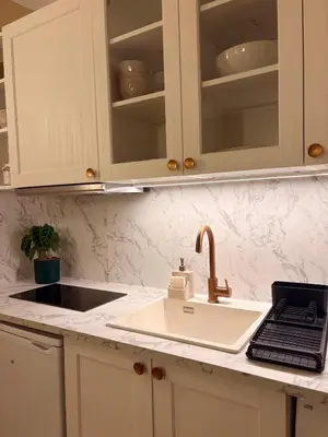 a kitchen counter with a sink and a faucet at Authentic Provençal Studio in Nice