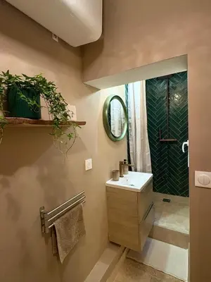 a bathroom with a sink and a shower at Authentic Provençal Studio in Nice