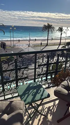 a balcony with a view of the beach and the ocean at Casa Giacometti Vue Mer Lumiere et Horizon in Nice