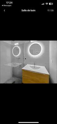 a bathroom with a sink and a mirror at Le riviera bay avec parking in Saint-Laurent-du-Var