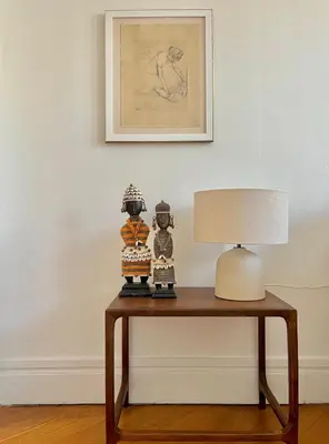 a table with a lamp and two figurines on it at Un cocon en centre ville de Nice 2 personnes in Nice