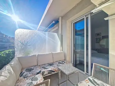 a balcony with a couch and a table and chairs at Nestor&Jeeves - TERRASSE D OR - By sea - Terrace in Nice