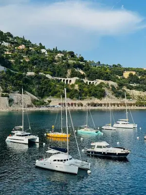 a group of boats sitting in a body of water at Studio de charme - Vieille Ville - Proche plage in Villefranche-sur-Mer