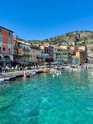 a group of boats in a body of water with buildings at Studio de charme - Vieille Ville - Proche plage in Villefranche-sur-Mer