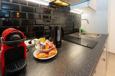 a kitchen counter with two bowls of food on it at Victoria 2 People Parking AC WiFi in Nice