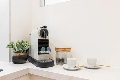a coffee maker and two cups on a counter at MY CASA - VERDI - Superb Studio Suite City Center in Nice
