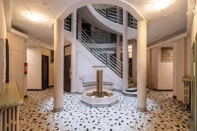 a hallway with a spiral staircase in a building at MY CASA - VERDI - Superb Studio Suite City Center in Nice