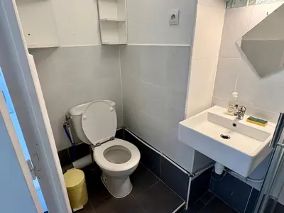 a small bathroom with a toilet and a sink at Parenthèse Niçoise - Cœur de Nice in Nice