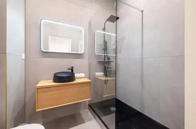 a bathroom with a sink and a mirror at Au cœur de Nice, Gare à pied et Climatisation in Nice