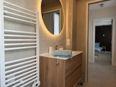 a bathroom with a sink and a mirror at Oscar II in Nice