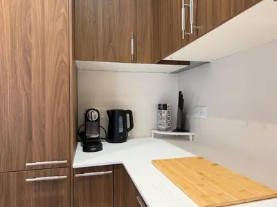 a kitchen with a coffee maker on a counter at Oscar II in Nice