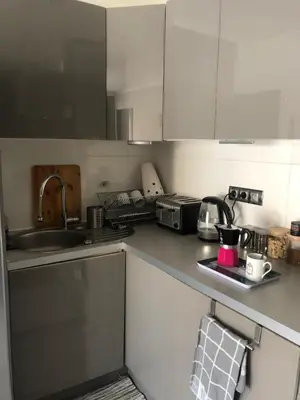 a kitchen with a sink and a counter top at Port of Nice Terrace Apartment in Nice