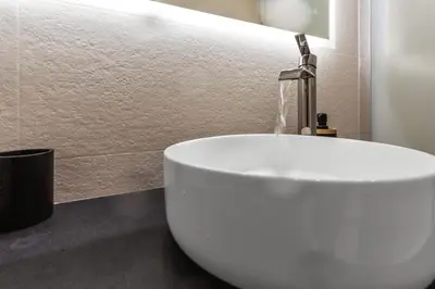 a white sink with a faucet in a bathroom at Le Pin - Peaceful - Parking - Comfort - AC in Saint-Laurent-du-Var