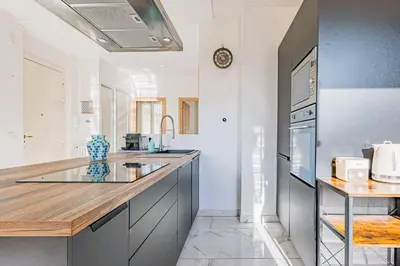 a kitchen with a sink and a counter top at Bail mobilité - Appartement 2 ch - Nice centre in Nice
