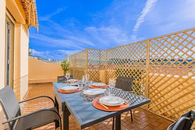 a blue table and chairs on a balcony at Bail mobilité - Appartement 2 ch - Nice centre in Nice